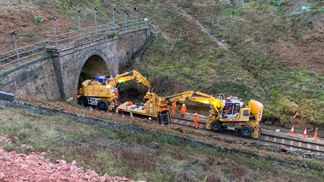 VIDEO: Line reopens between Axminster and Pinhoe, after engineers make great progress on landslip prevention work in Honiton, in Devon: Engineering trains at Honiton tunnel