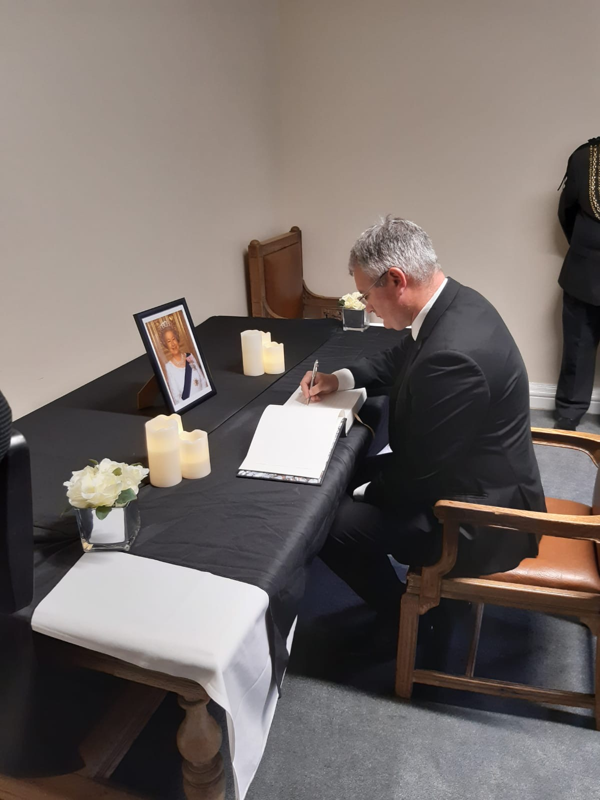 Book of condolence: Councillor James Lewis, leader of Leeds City Council signs the book of condolence for Her Majesty The Queen at Leeds Civic Hall. For a copy of this image in colour, please download it directly or contact the media team.