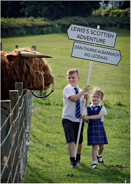 Molly (5) and Adam (8) Cook from Bun-sgoil Beinn Chamshroin (Mount Cameron Primary Gaelic School) meet Lewis the Bull at the National Museum of Rural Life, East Kilbride as they launch the attraction’s new bilingual family trail. Named after Lewis, the trail introduces children to Scottish farming objects and rural traditions and teaches English-speaking visitors some simple Gaelic words.-3