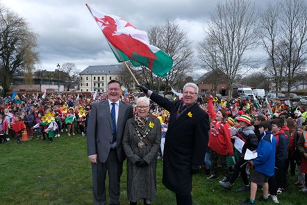Guy Woodham, Pat Davies and David Simpson flying Welsh flag at St David's Day parade