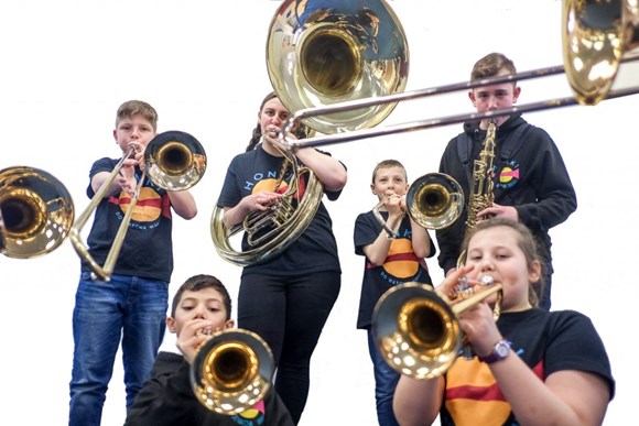 Young people playing music instruments