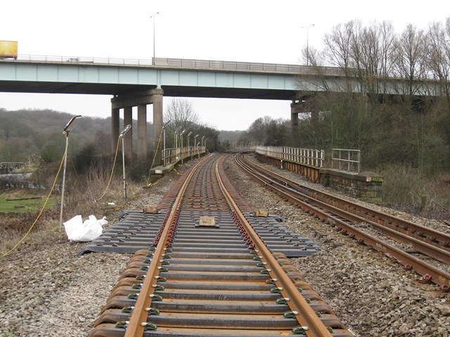 Gathurst - Appley Bridge improvement work: New rail on steel sleepers on approach to Gathurst Viaduct in the shadow of M6 motorway