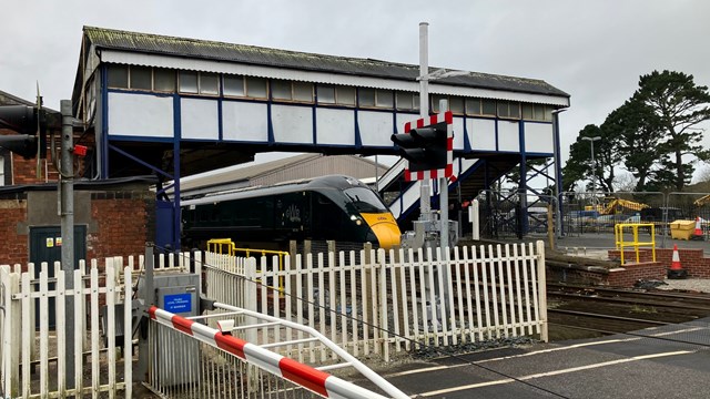 Final phase of Devon and Cornwall signalling upgrade set to bring a more reliable railway: GWR train at Truro station with level crossing that will be upgraded 