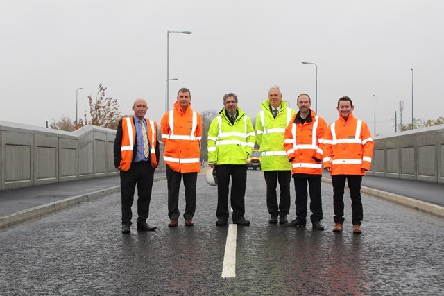 Staff from Network Rail, Tameside Metropolitan Borough Council and Murphy on the new Richmond Street bridge in Aston-under-Lyne