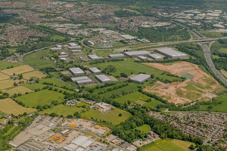 An illustrative CGI of the site showing an aerial view of this site, looking from Farington area towards the M65 junction.