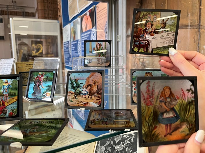 Magic lantern slides: Rhian Isaac, special collections librarian at Leeds Central Library, with the vintage magic lantern slides featuring moments from classic tales including Alice in Wonderland, Peter Pan and Aladdin.