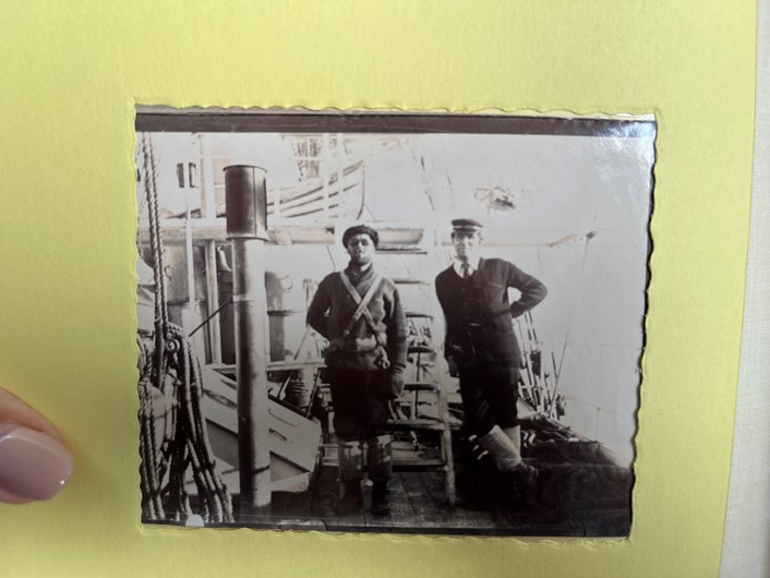 Antarctic photo album: Photo from the album believed to show the ship's captain Hull-born sailor William Colbeck (right). 
Images from the album images capture what life was like aboard the ship, the crew and the breath-taking scenery they saw from the deck each day of their voyage.
It is believed they were taken by John Donald Morrison, The Morning’s chief engineer and many of the crew are featured, including the ship’s dogs.