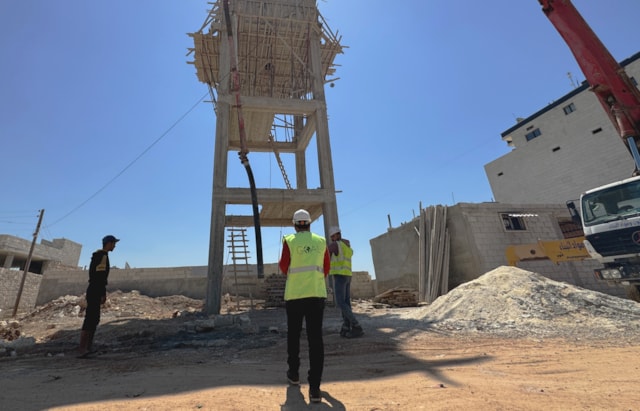 GOAL teams are constructing a water tower to ensure that residents of Al-Wadah displacement camp, host to more than 5,000 people, can have regular access to clean piped water. Jandires, Northern Aleppo, Syria. April 2024.-2