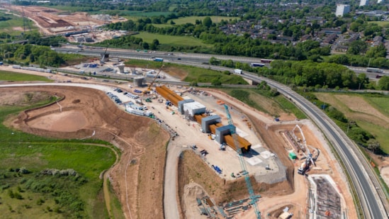 Aerial view of the first section of the M6 South viaduct being assembled alongside the road May 2025: Aerial view of the first section of the M6 South viaduct being assembled alongside the road May 2025