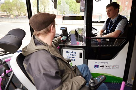 First Bus driver helping passenger