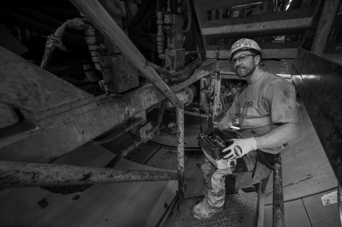 Gary Jones affixes the concrete segments into place to form the tunnel walls