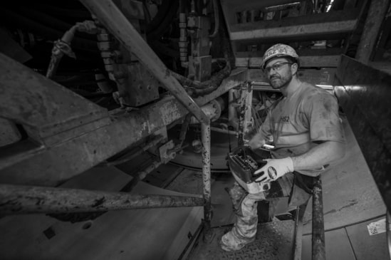 Gary Jones affixes the concrete segments into place to form the tunnel walls