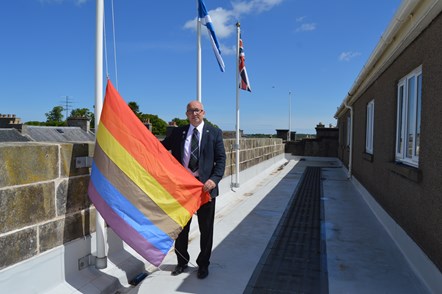 Convener Cllr Marc Macrae with Pride flag