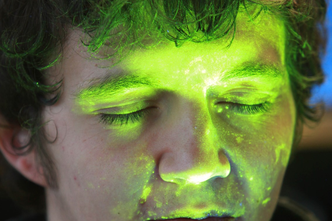 SmartWater on skin: SmartWater showing up under ultra violet light.
(Note - actor used for photograph)