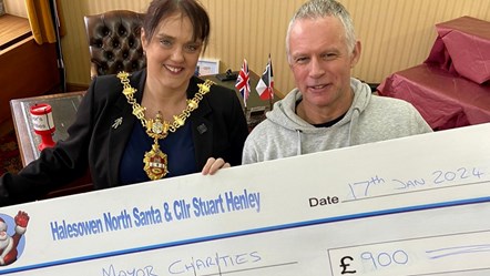 The Mayor of Dudley receives a donation for her charities from Cllr Stuart Henley and the Halesowen Santa Runs