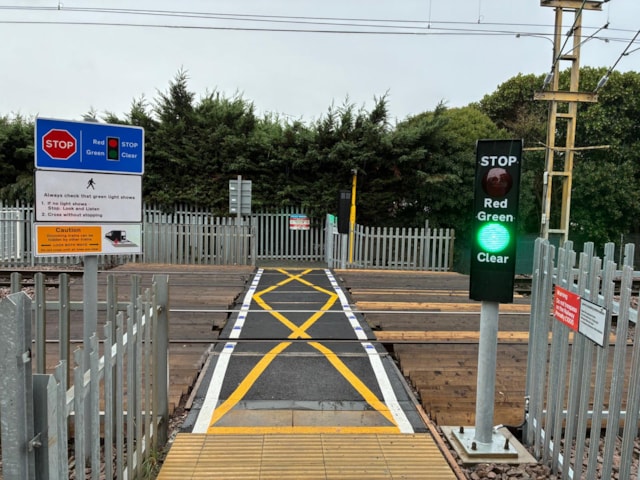 Woodgrange Close level crossing – with newly-installed red and green lights: Woodgrange Close level crossing – with newly-installed red and green lights