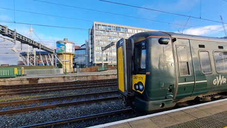 A Class 387 Electrostar at Cardiff Central, with the Principality Stadium in the background