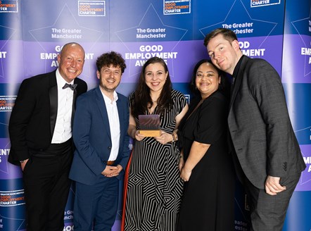 This image shows the Northern team holding their award