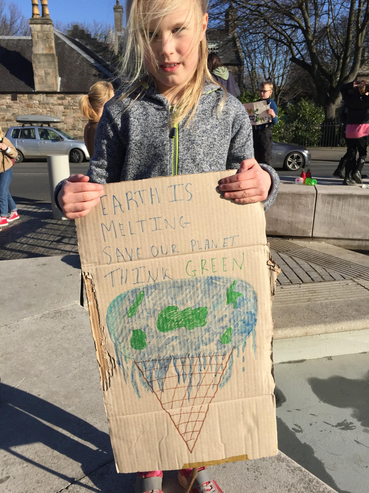 Bridget aged 8, outside the Scottish Parliment for the School Strike for Climate protest in 2019 . Image courtesy of Bridget's family