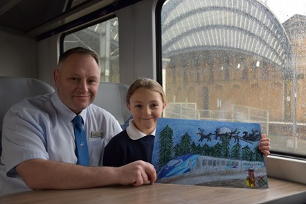 Quinn Kelly (8) from York won a competition to design TPE’s Christmas card after her brilliant artwork received a festive seal of approval. Pictured with dad Adam Kelly, TPE conductor instructor