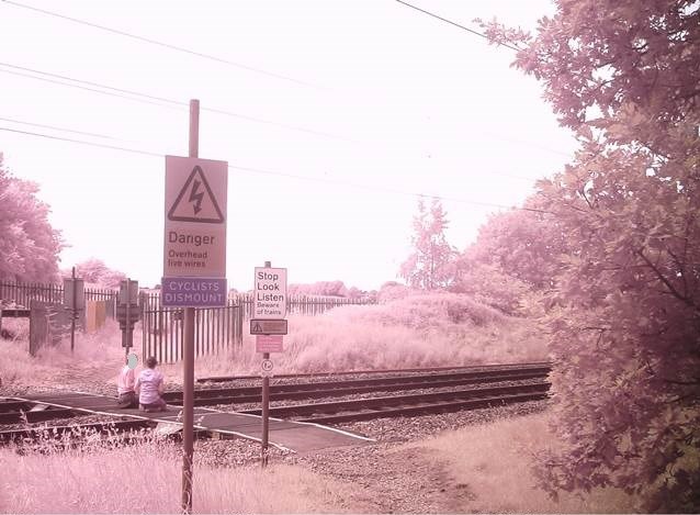 Doncaster parents urged to speak to children about dangers of trespassing on the railway amid school closures: Pedestrians sitting on level crossing in Doncaster