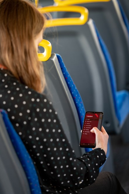 Passenger using bus app on Hedingham bus