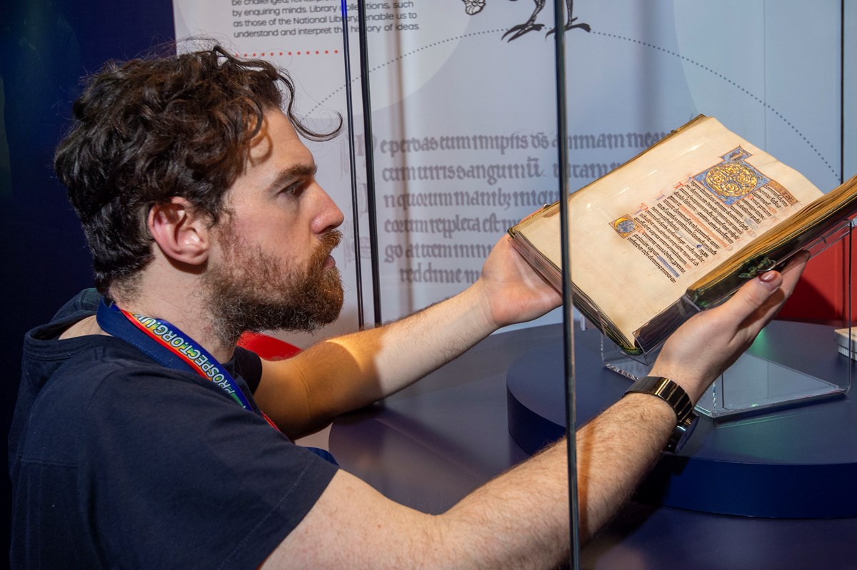 Conservation Exhibitions Specialist Ryan Gibson installing the Iona Psalter. Credit: Neil Hanna