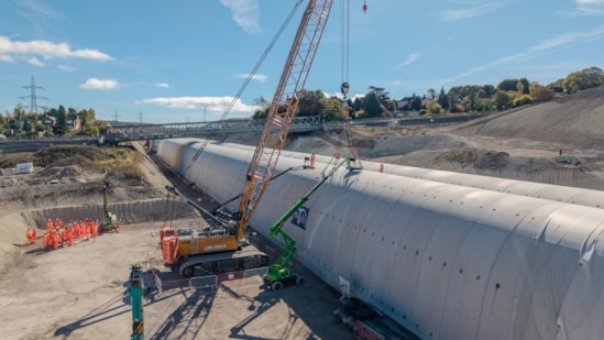 Progress for HS2’s Wendover green tunnel: The last segment being lifted into poistion at Wendover green tunnel as the site team look on October 2026