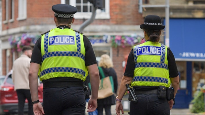 Uniformed officers on patrol 1 cropped: Uniformed officers on patrol 1 cropped