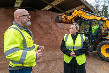 Finance Minister with gritter operator outside