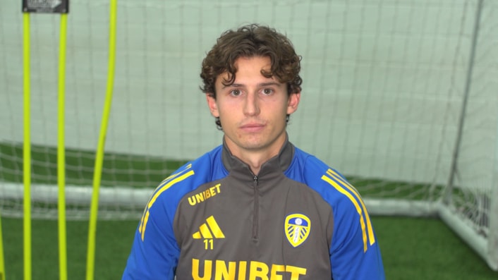 Suicide Prevention Champions - Brenden Aaronson: Brenden is pictured in a LUFC branded top, with a goal behind him, looking at the camera.