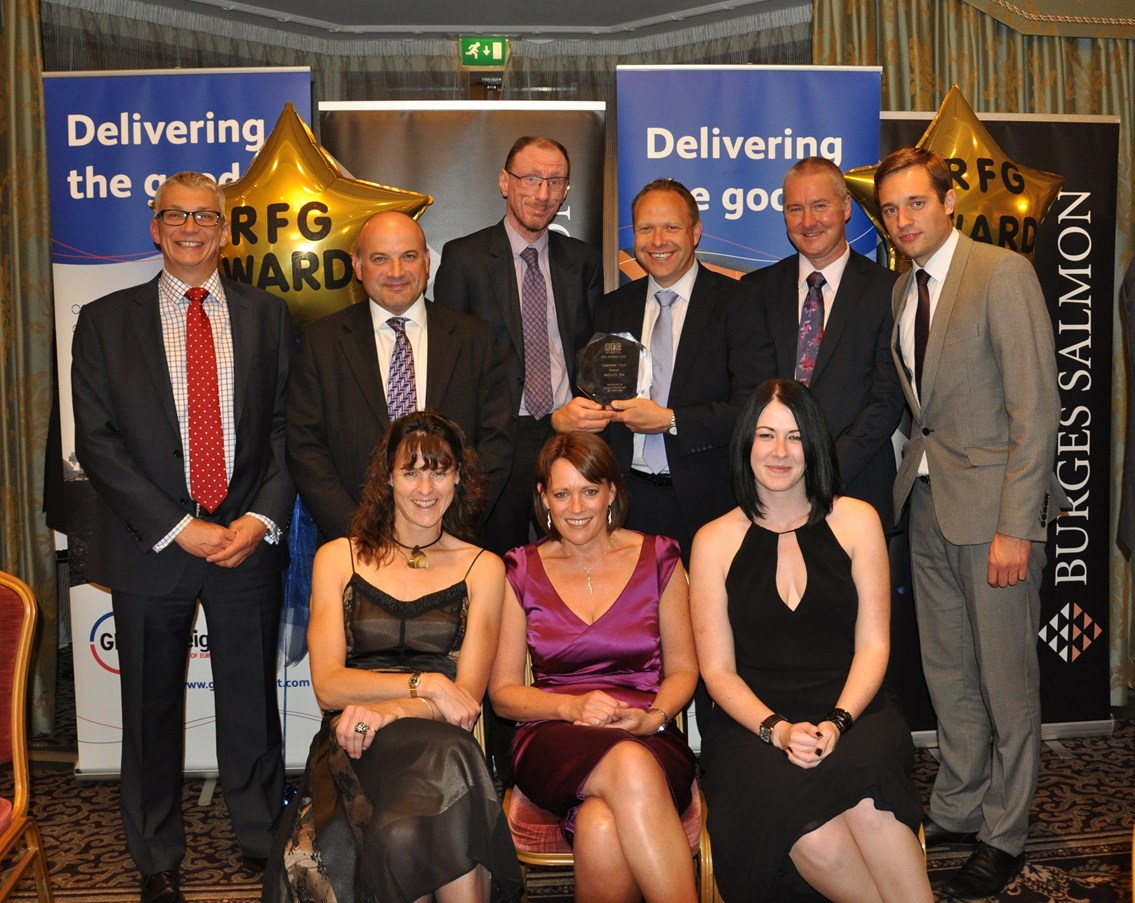 Network Rail collects the Customer Care award from the Rail Freight Group: Customer Care – Back LtoR: Philip Hassall (DB Schenker), Rob Freeman (NR), Stephen Draper (NR), Steve Rhymes (NR) Norman Egglestone (Direct Rail Services), Liam Day (NR). Front LtoR: Jules Graham (NR), Rachel Gilliland (NR), Ilona de Carteret (NR).