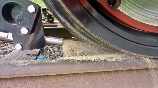 Close up of rail sanding process
