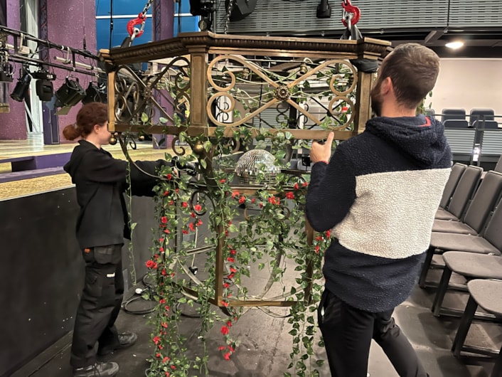 Panto chandelier: Carriageworks technicians have been busy breathing new life into the elegant light fitting, polishing up its elaborate ornamental brass ahead and using all the tricks of the trade to ensure it looks its brilliant best.

Although its age means it can no longer be powered by electricity, by carefully affixing a disco ball to the centre of the chandelier, stage lights can be reflected through its bulbs and around the theatre’s auditorium.

Vines and roses have also been draped from the chandelier, in keeping with the décor of The Beast’s castle