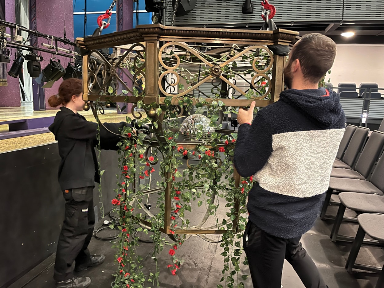 Panto chandelier: Carriageworks technicians have been busy breathing new life into the elegant light fitting, polishing up its elaborate ornamental brass ahead and using all the tricks of the trade to ensure it looks its brilliant best.

Although its age means it can no longer be powered by electricity, by carefully affixing a disco ball to the centre of the chandelier, stage lights can be reflected through its bulbs and around the theatre’s auditorium.

Vines and roses have also been draped from the chandelier, in keeping with the décor of The Beast’s castle