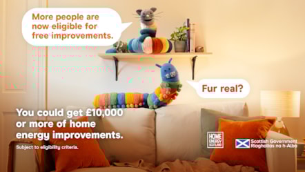Home Energy Scotland promo image with knitted cat & caterpillar toys on a shelf. Speech bubbles say 'More people are now eligible for free improvements' and 'Fur real?'. Text below: 'You could get £10,000+ of home energy improvements. Subject to eligibility.