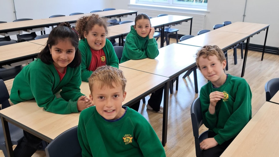 Pictured on the back row from left to right in one of the new classrooms at Lea Community Primary School are pupils Samaira, Etta and Alana and on the front row, from left to right are Vinny and Samuel