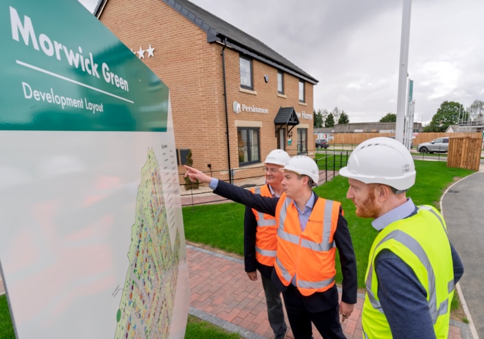 CHGP Morwick Green 4: Pictured left to right: Councillor James Lewis (leader of Leeds City Council), Councillor Tom Hinchcliffe (Leeds City Council's executive member for transport and planning) and Sean Eames (head of external affairs at Persimmon PLC) at the Morwick Green housing development in Leeds.