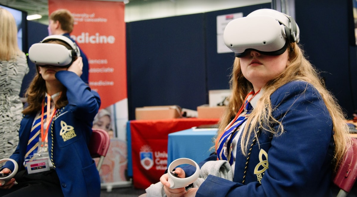 Students use virtual reality to experience a clinical interactive demo at the 2024 TeenTech Lancashire Festival.