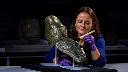 WEB Conservator Bethan Bryan with the Roman arm guard. Photo (c) Duncan McGlynn (8)