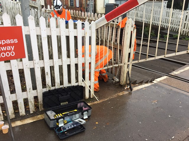 Network Rail engineers fixing the level crossing barrier at Hartlebury