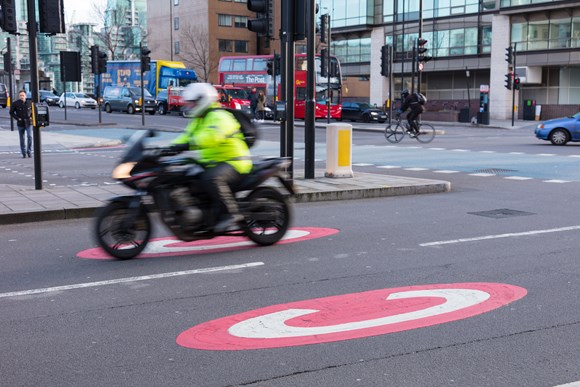 TfL and other organisations call on the Government to strengthen basic motorcyclist training to improve road safety: TfL Image - Motorcyclist on Millbank