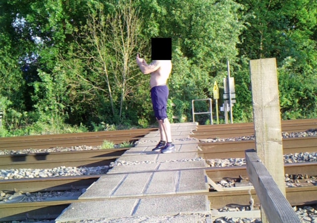 A man stops on Wantage Road level crossing to take photos- May 2025: A man stops on Wantage Road level crossing to take photos- May 2025