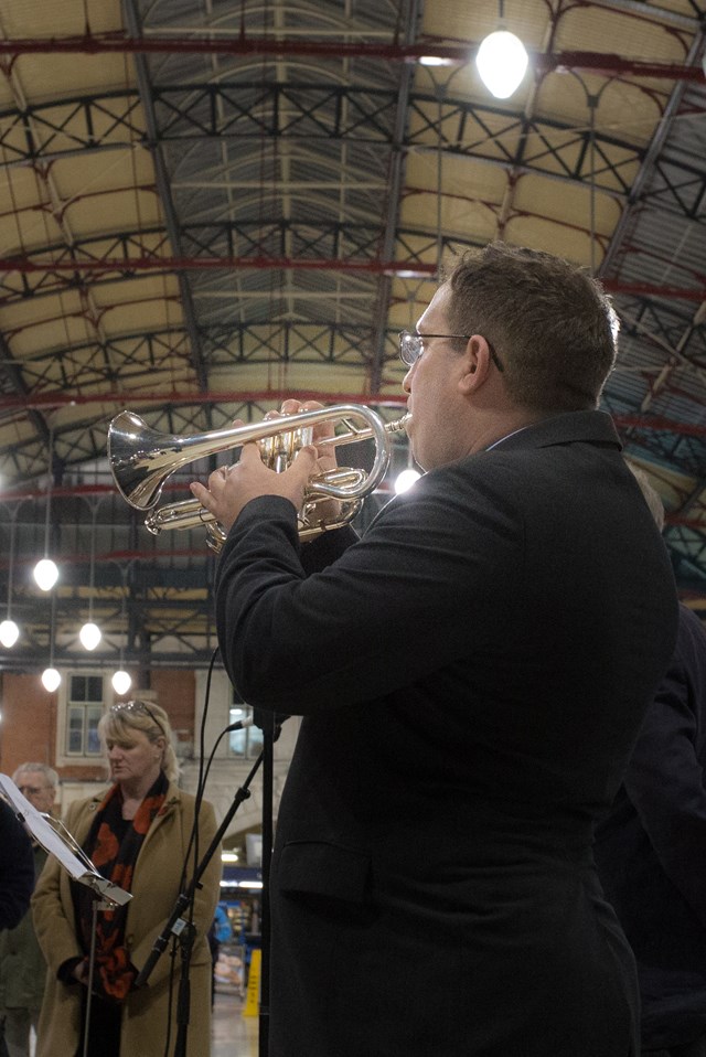 Cornet player Terry Hissey plays the Last Post at Victoria Station, Nov 10, 2016