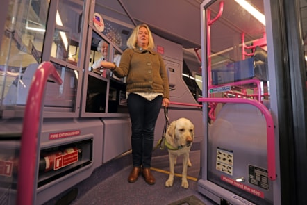 Verity with guide dog Ted and Keith Sheard of First York