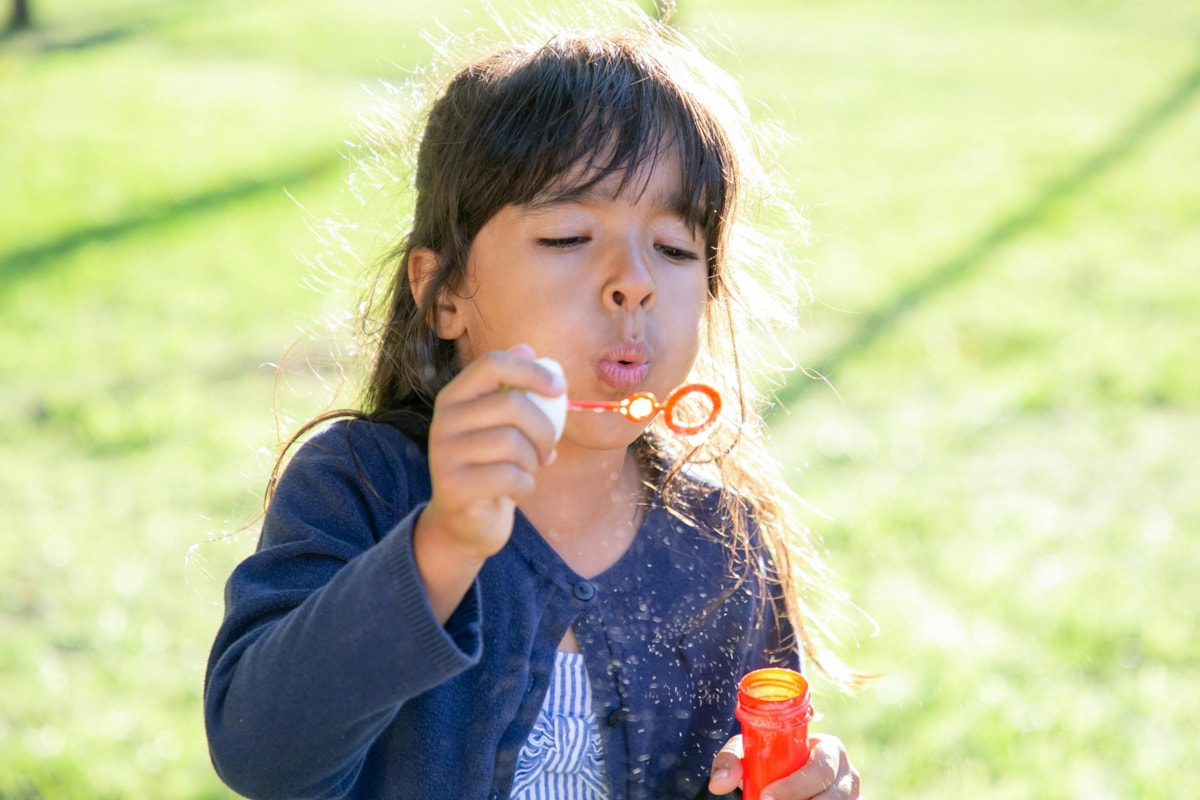 Girl blowing bubbles