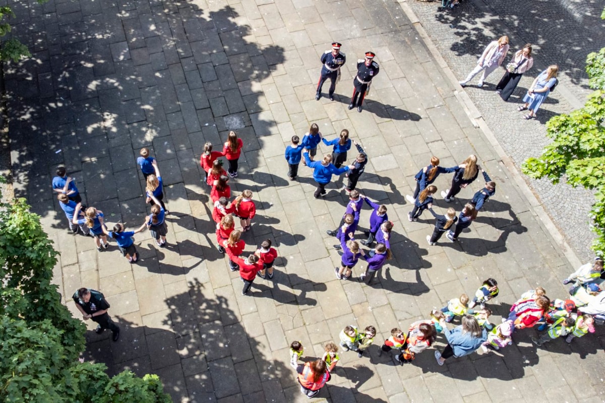 The Lord-Lieutenant of Moray, Alistair Monkman and Lord Lieutenant of Banffshire, Andrew Simpson join Elgin primary school pupils on the Plainstones as they spell out VE80 to commemorate the 80th anniversary of VE Day.

Image: Jason Hedges/DC Thomson