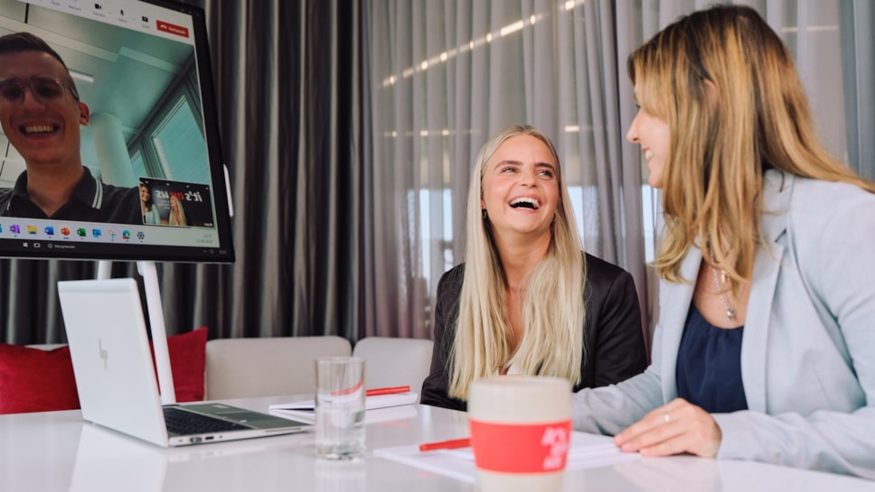 Smiling female colleagues