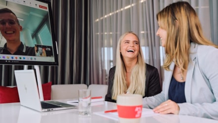 Smiling female colleagues