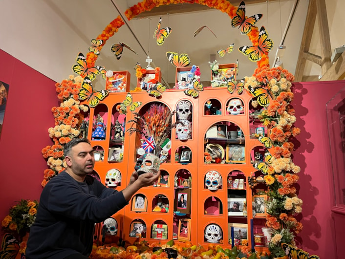 Living with Death: Adam Jaffer, Leeds Museums and Galleries' curator of world cultures, with a stunning Leeds Ofrenda, on loan from artist Ellie Harrison, recreates beautiful, traditional Mexican Day of the Dead displays.
Leeds City Museum’s Living with Death exhibition, which opens today (May 3) features a remarkable array of objects spanning thousands of years of world history and tradition which all explore how different cultures experience death, dying, and bereavement.